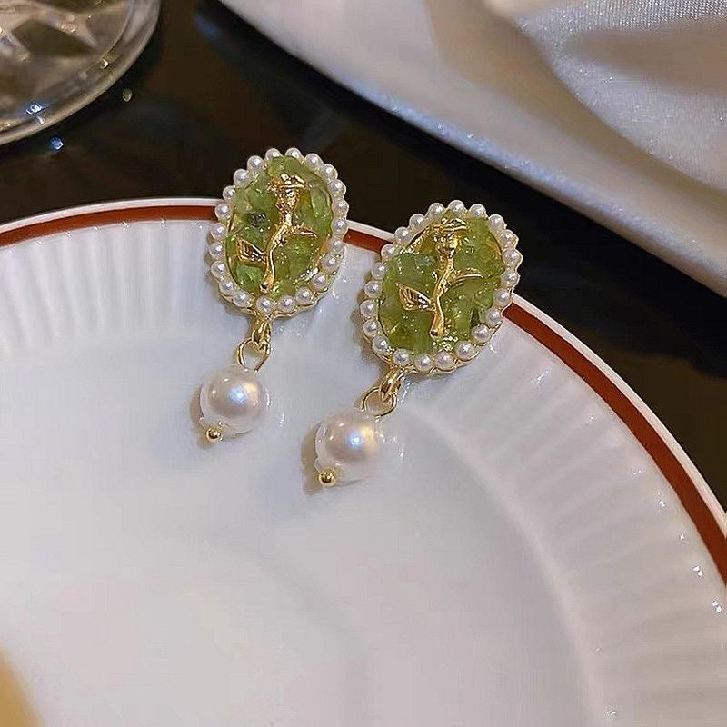 Green earrings with flowers