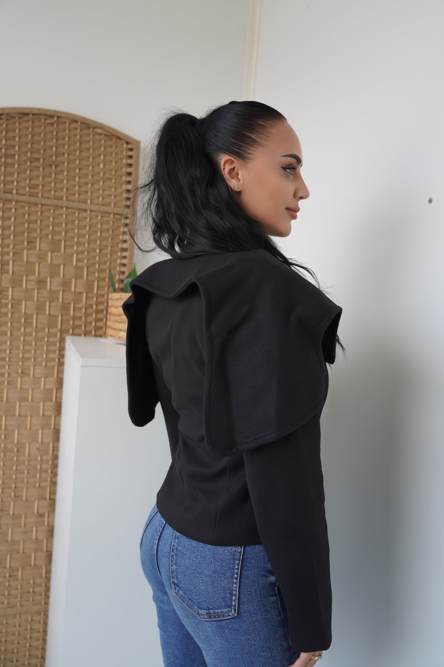Elegance with a modern twist — this structured black jacket with bold gold buttons brings sophistication and power to your everyday style